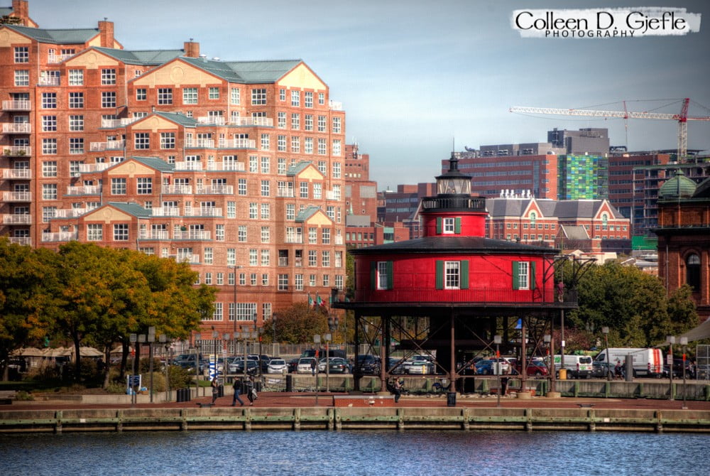 Scene in Baltimore harbor with red lighthouse