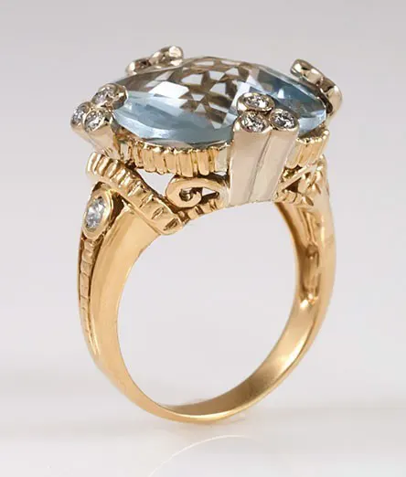 Gold ring featuring large blue stone
